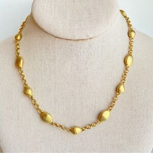 Etienne Aigner signed brushed goldtone nugget station necklace on goldtone chain